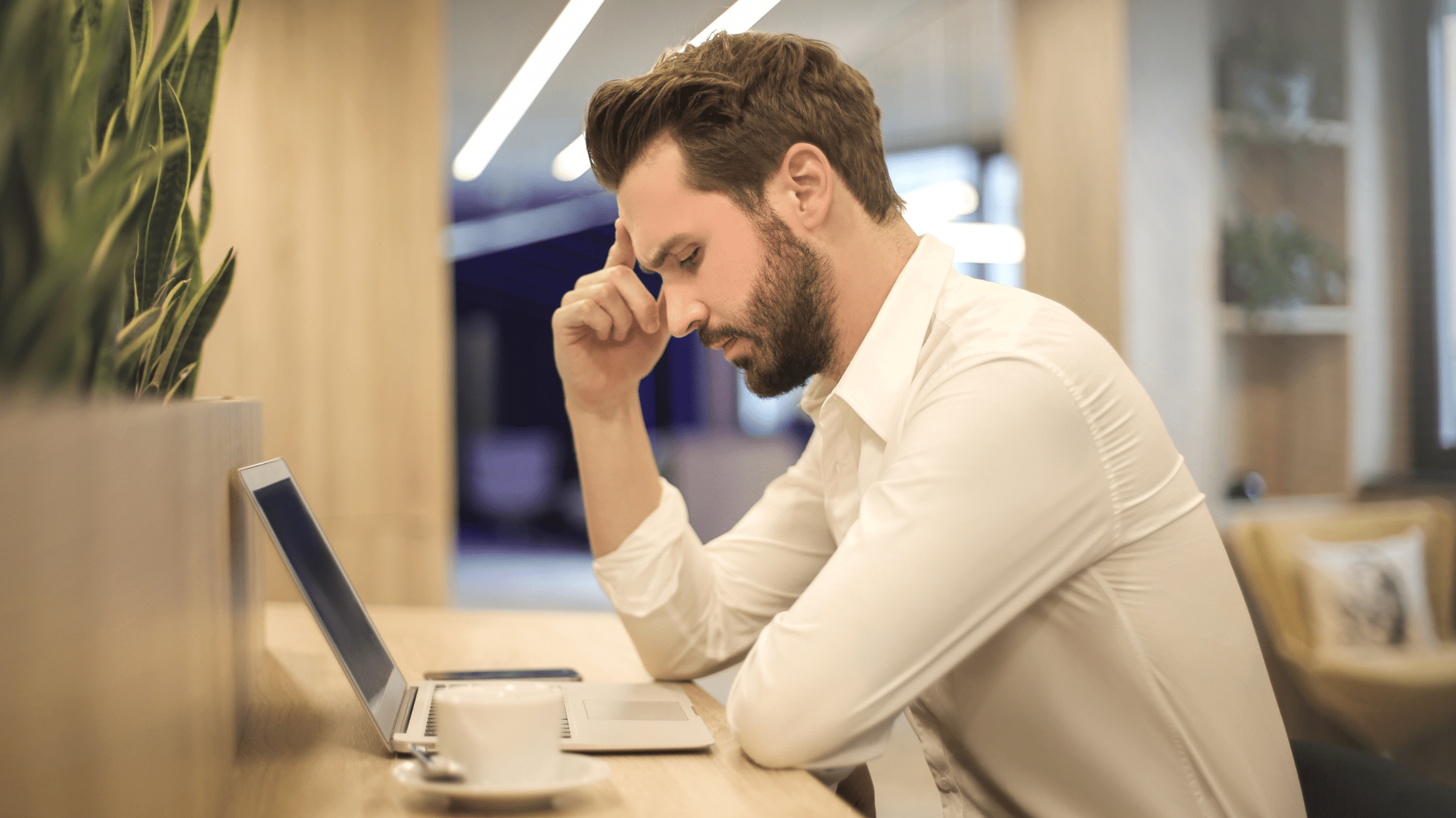 Student at his desk looking at his laptop and interpreting MCAT Practice Test Scores